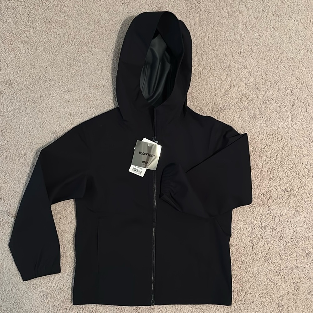 Never worn Kids raincoat size 7-8.